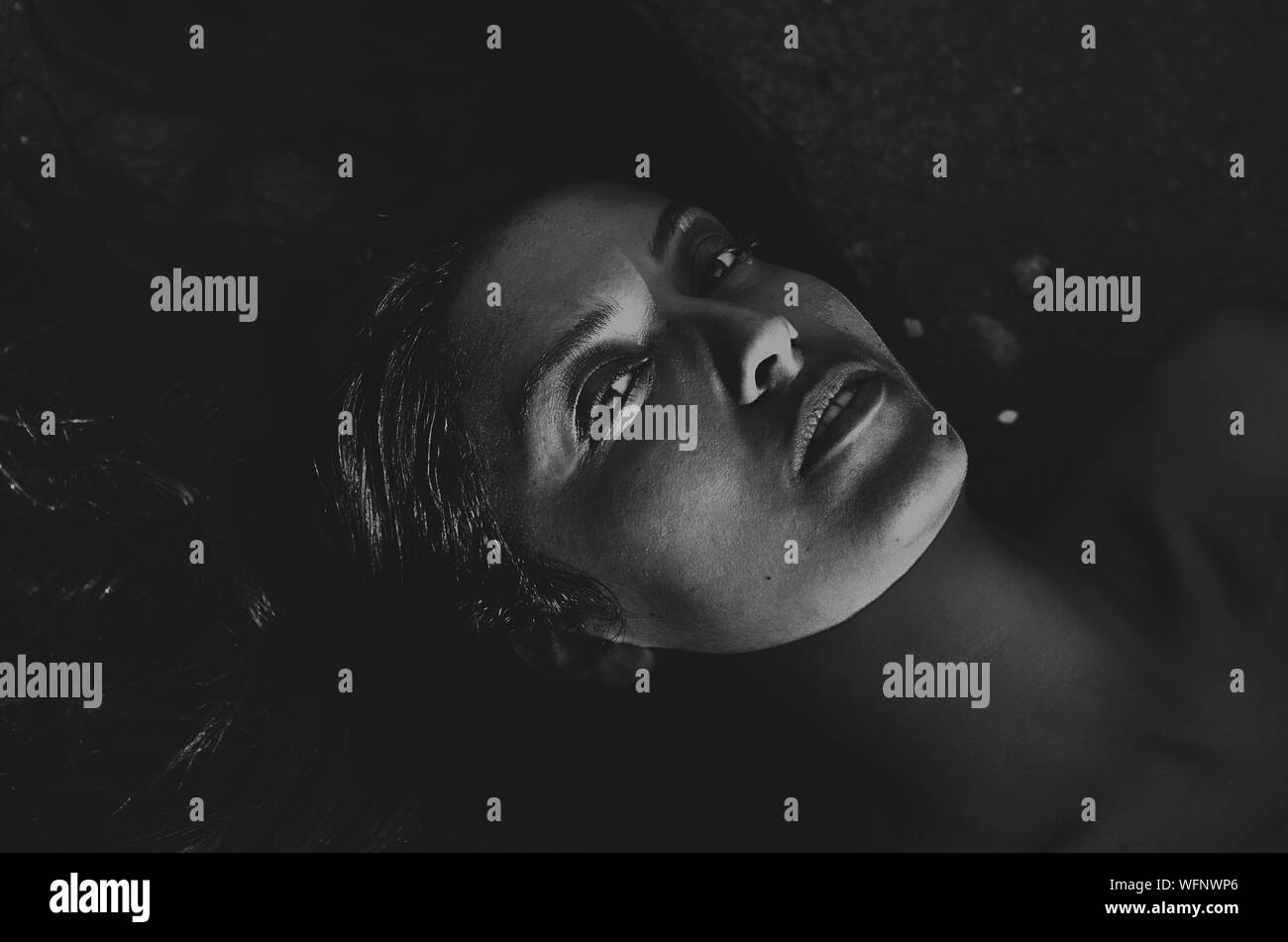 Woman lying down looking up Black and White Stock Photos & Images - Alamy