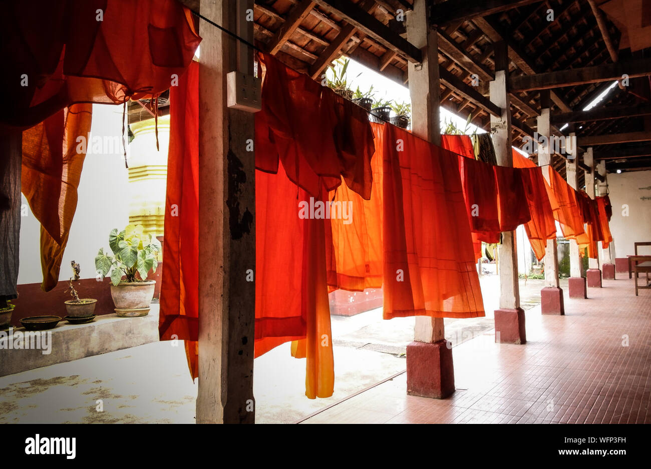 Orange Robes Drying In Corridor Stock Photo Alamy