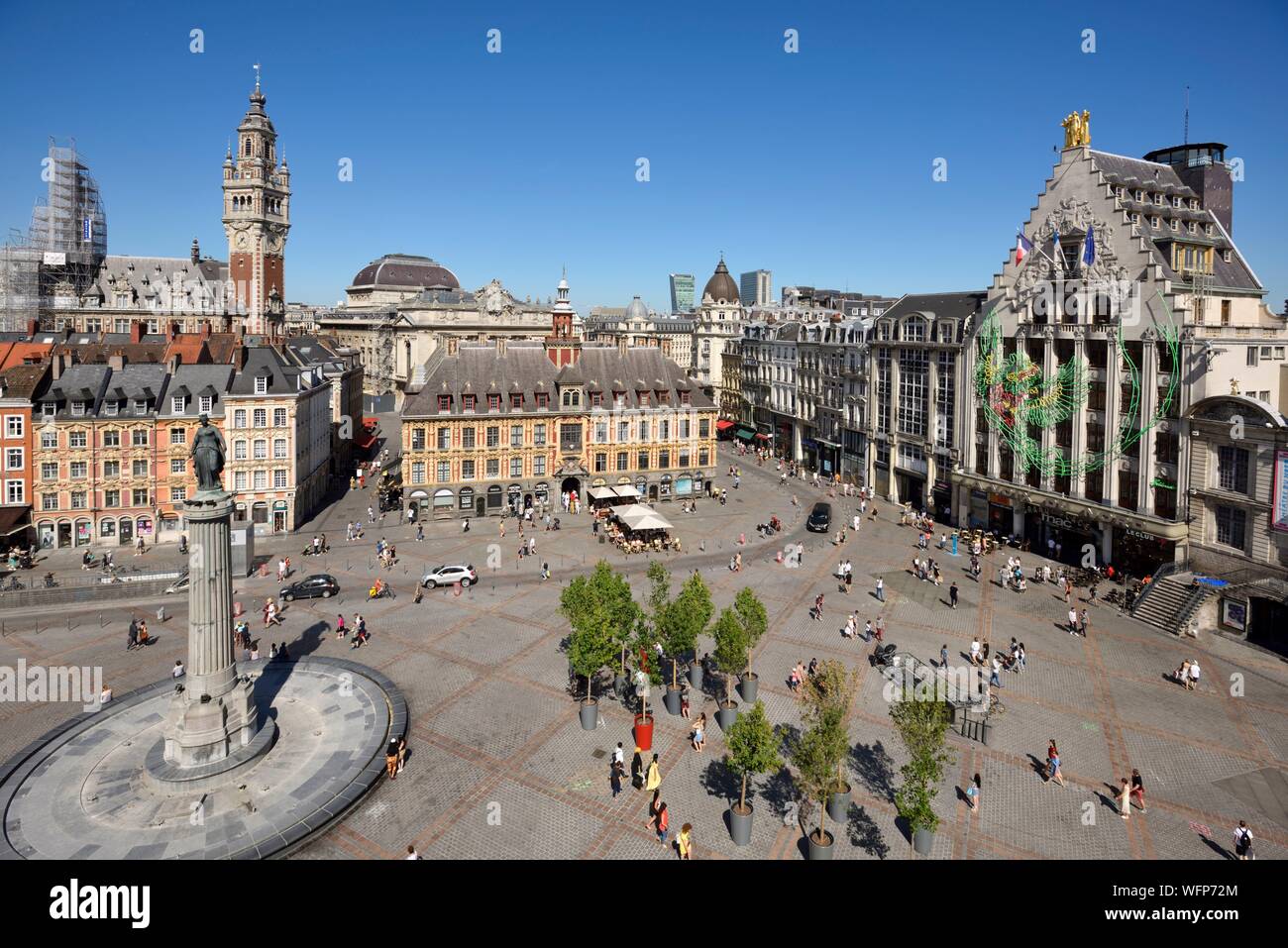 France, Nord, Lille, Place du General De Gaulle or Grand Place, statue of the goddess on its column with the old stock exchange and the belfry of the Chamber of Commerce and Industry in the background Stock Photo