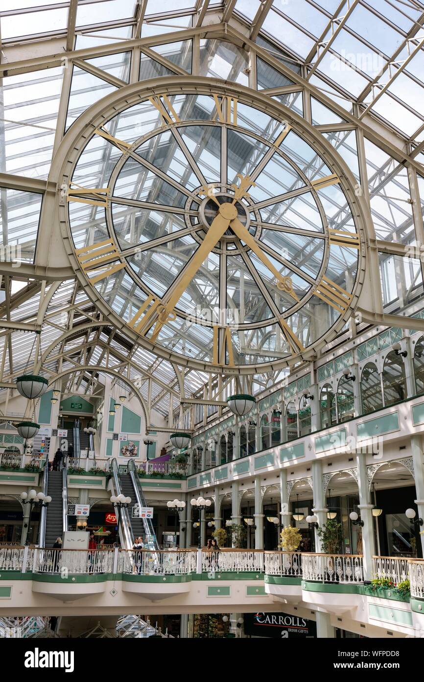 Ireland, Dublin, Stephen's Green Shopping Center, large covered shopping center at the top of Grafton Street, glass and iron architecture, giant clock Stock Photo