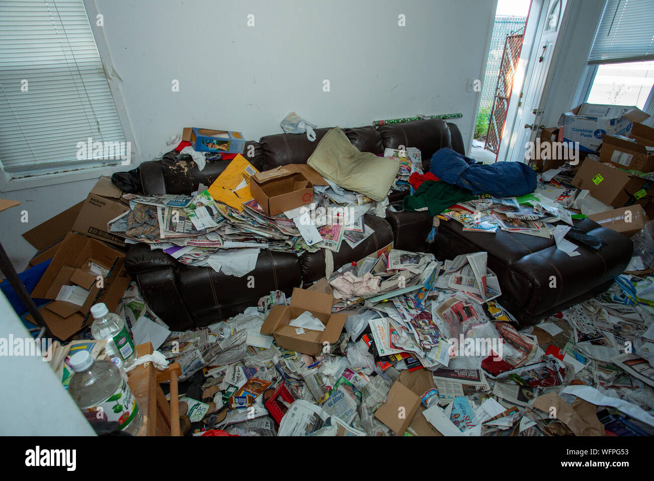 Living room area of an apartment of a hoarder with mental illness Stock Photo