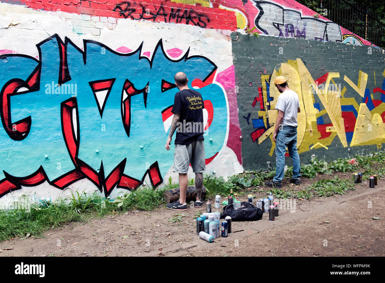 Graffiti artists at work, Parkland Walk, London Borough of Islington Stock Photo