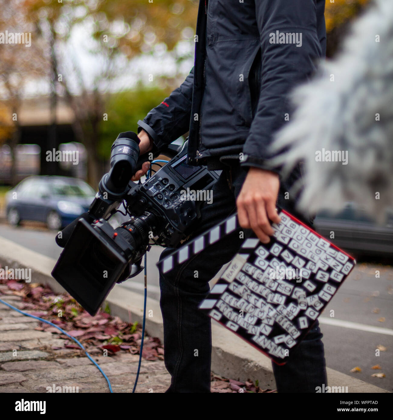 Cameraman with all your Equipment Ready to Record on the Street Stock