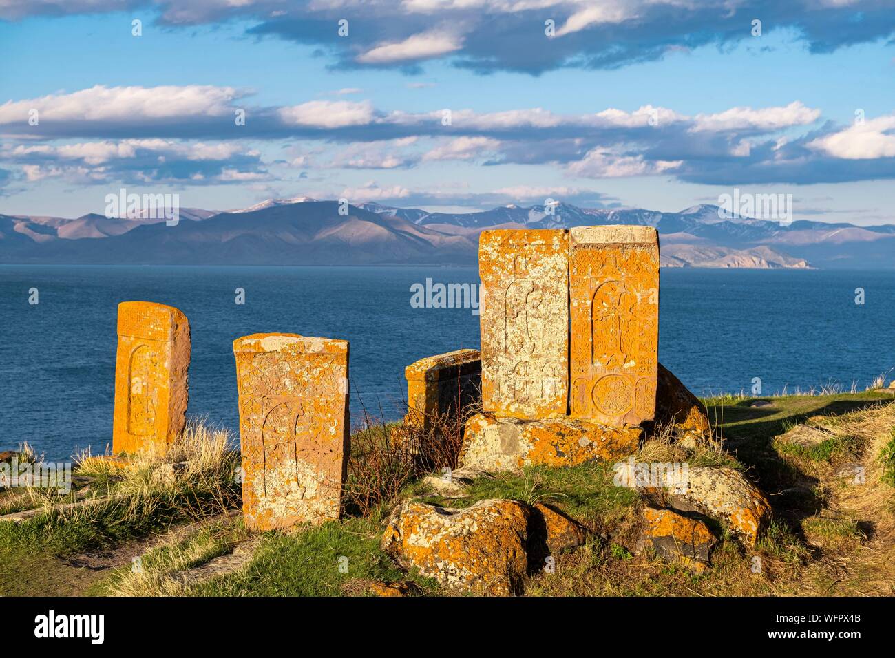 Armenia, Gegharkunik region, Hayravank, the 9th and 10th centuries Hayravank monastery built on a rocky promontory overlooking Sevan Lake, khatchkars (carved memorial steles) Stock Photo