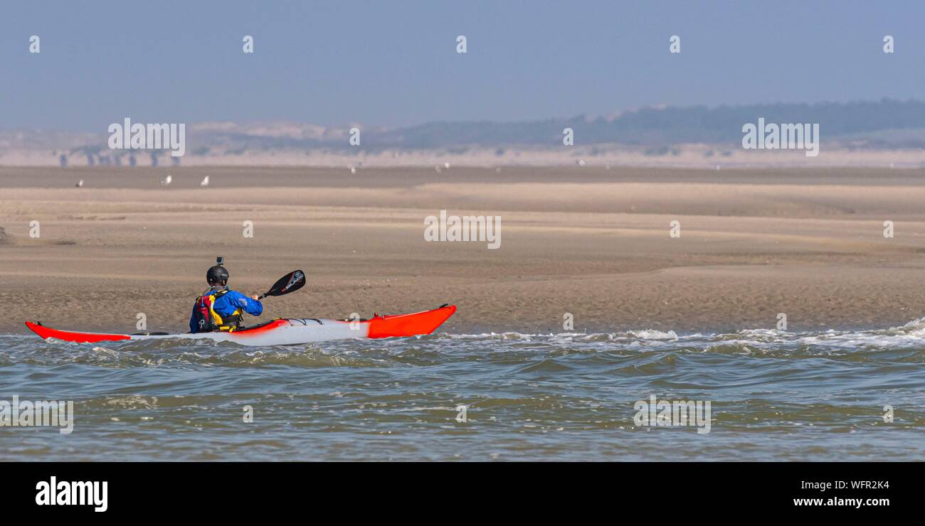 France, Somme, Baie de Somme, Le Hourdel, Indonesian canoes and canoe kayak  during high tides, the boats come to wait for the flow and the tidal bore  at the entrance of the