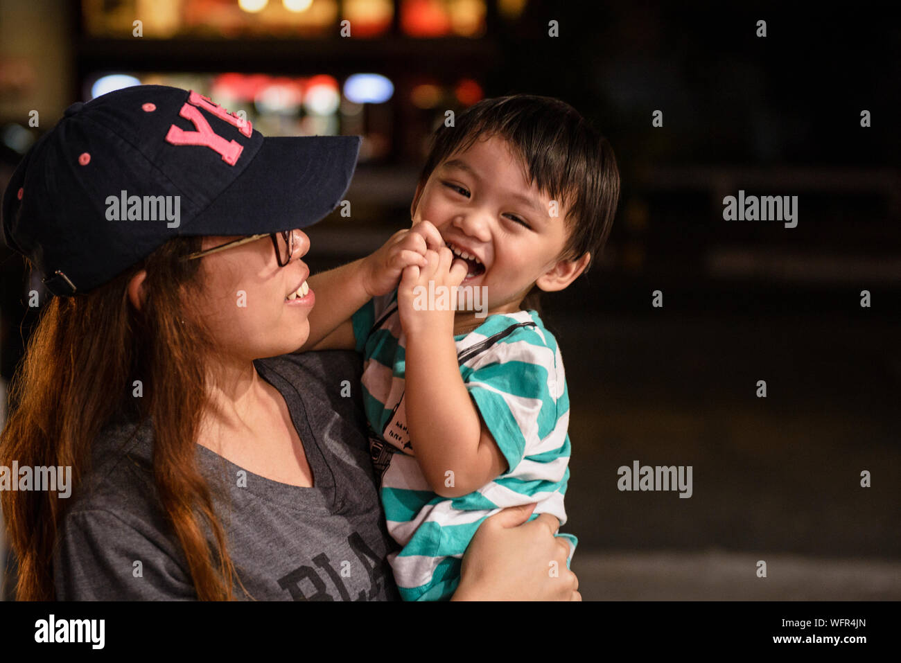 Indian woman carrying baby on hi-res stock photography and images - Alamy