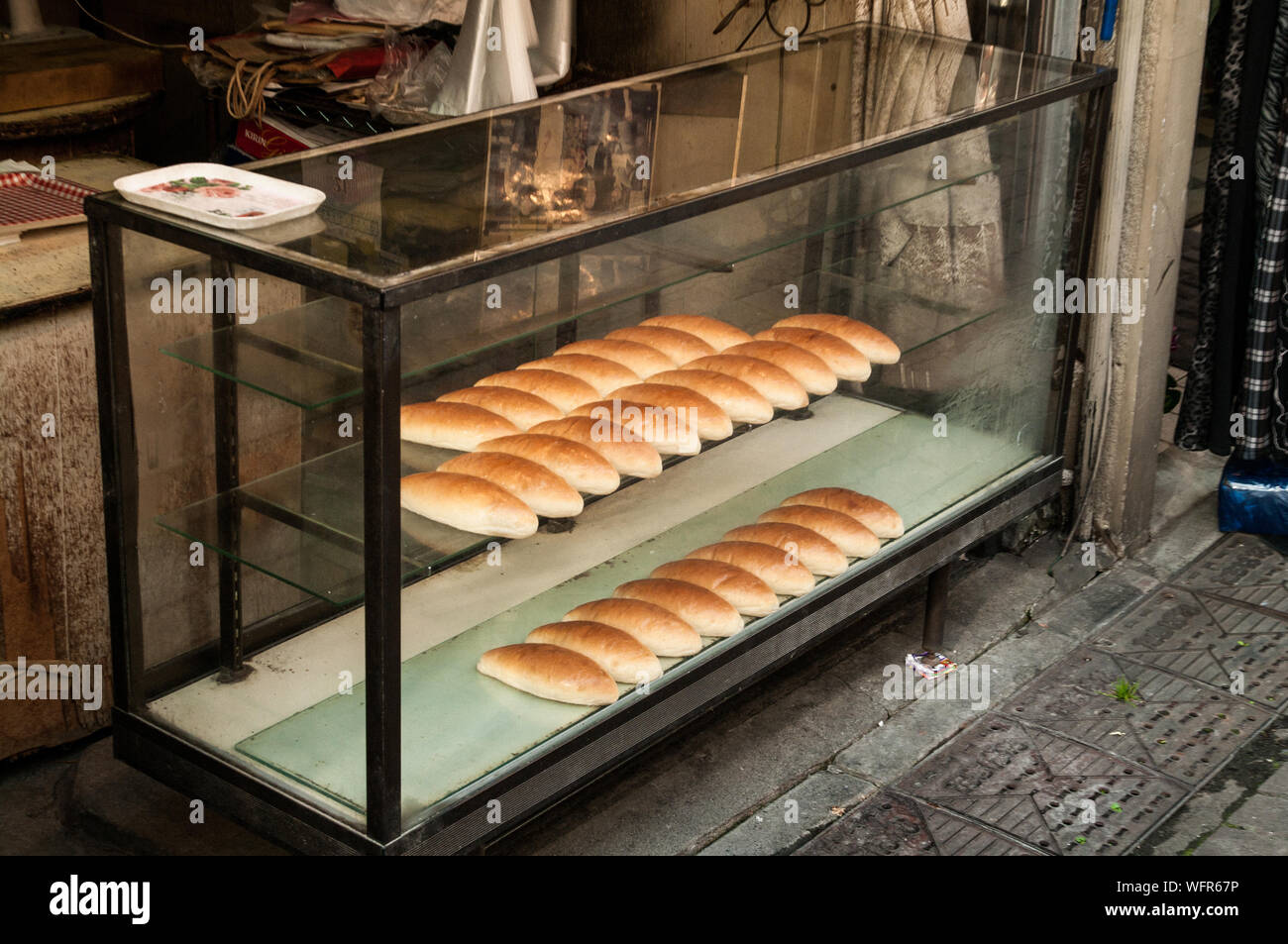 Breads In Display Cabinet At Bakery Stock Photo