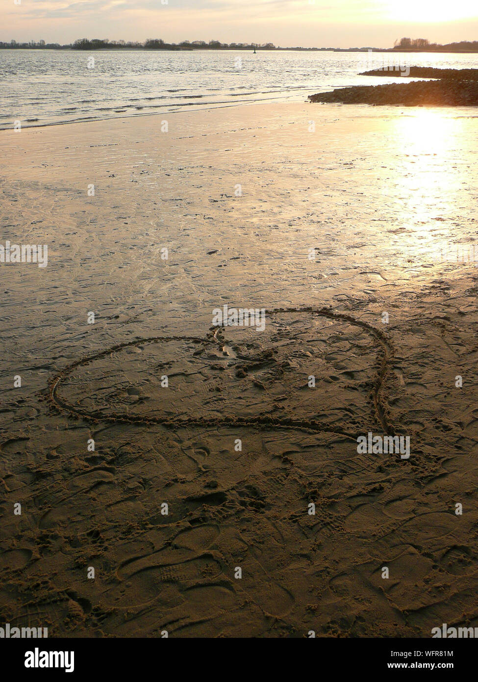 Heart shape drawn sand beach beach hi-res stock photography and images ...