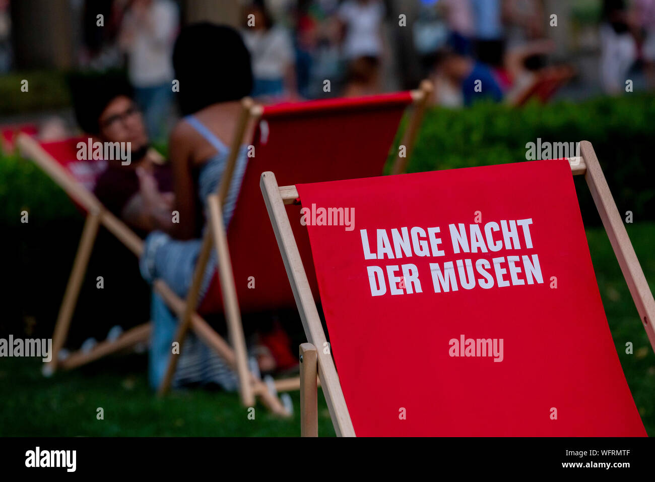 Berlin, Germany. 31st Aug, 2019. 'Long Night of the Museums' can be read on a deck chair on the Museum Island. 75 museums open their doors until 2 a.m. at night. Credit: Christoph Soeder/dpa/Alamy Live News Stock Photo