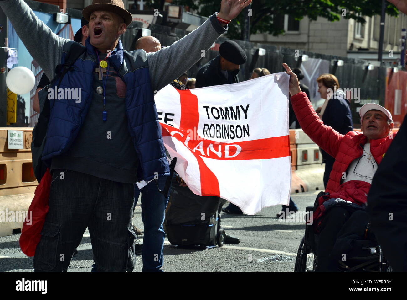 A small group of Tommy Robinson supporters protest at an Extinction  Rebellion event which has blocked Deansgate in central Manchester, uk, on  31st August, 2019, the second day of a four day