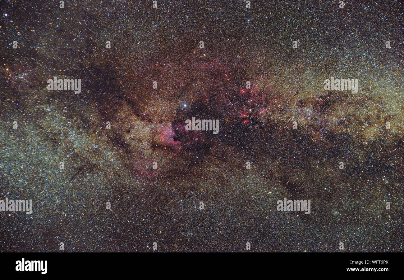 Cygnus nebulae in the heart of Milky Way galaxy. Hydrogenic nebulosity of Milky Way. Deep starry sky Stock Photo
