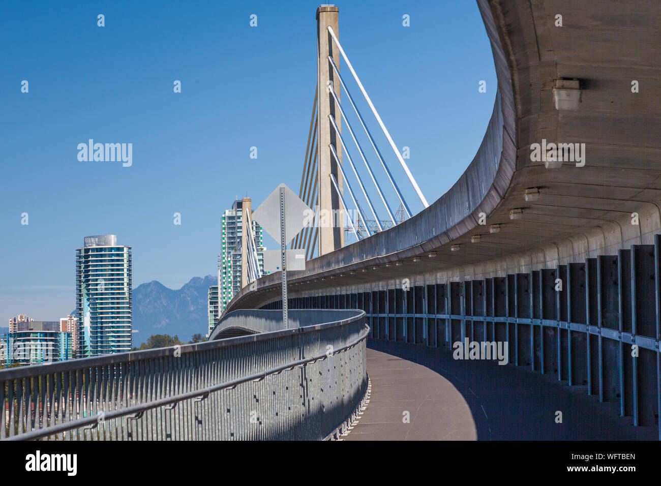Pedestrian and cycle route attached to the Canada Line transit bridge over the Fraser River in Vancouver Canada Stock Photo