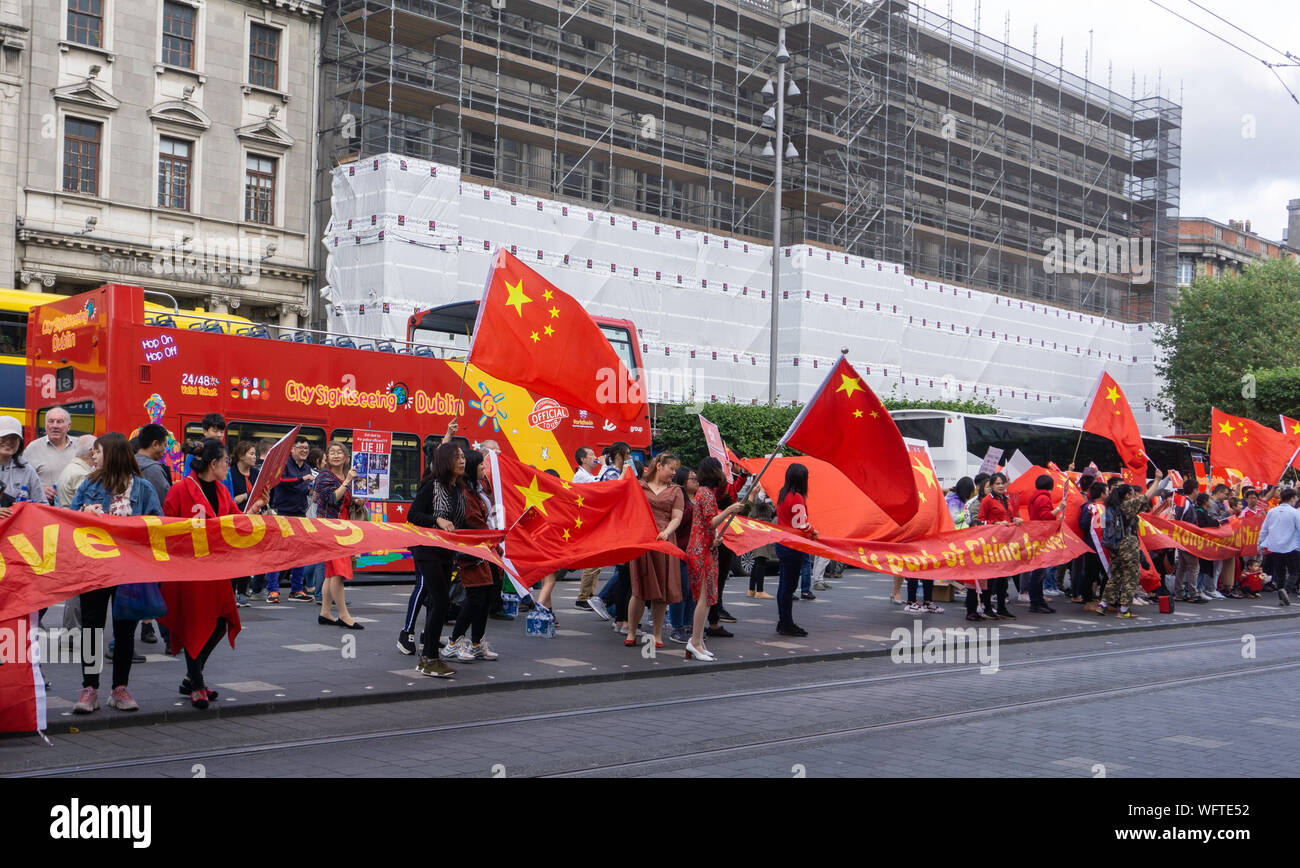 Pro Chinese government supporters stage a counter demonstration in  O'Connell Street, Dublin, Ireland. Stock Photo