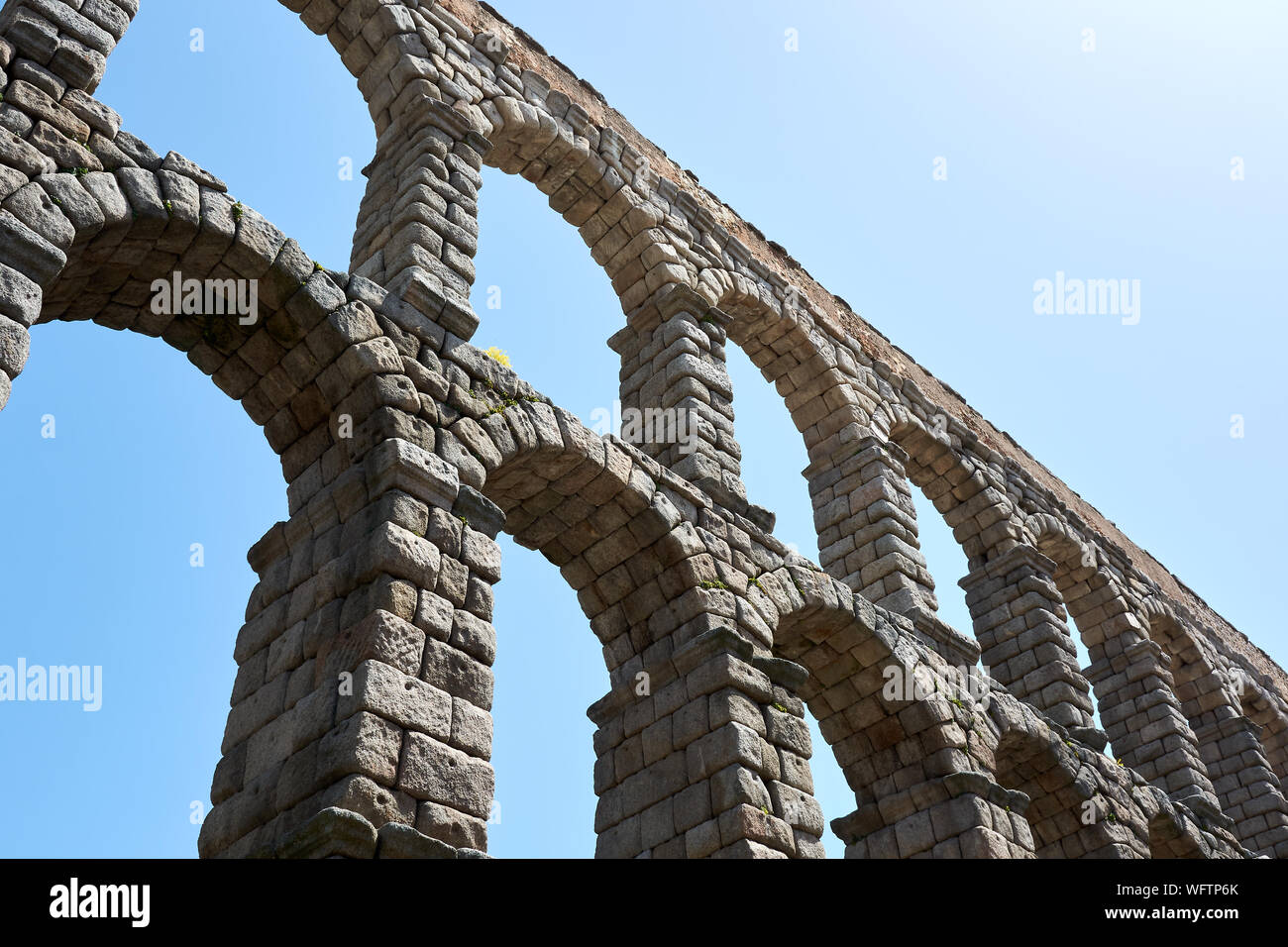 SEGOVIA, SPAIN - APRIL 25, 2018: Details of the Roman Aqueduct in Segovia. Stock Photo