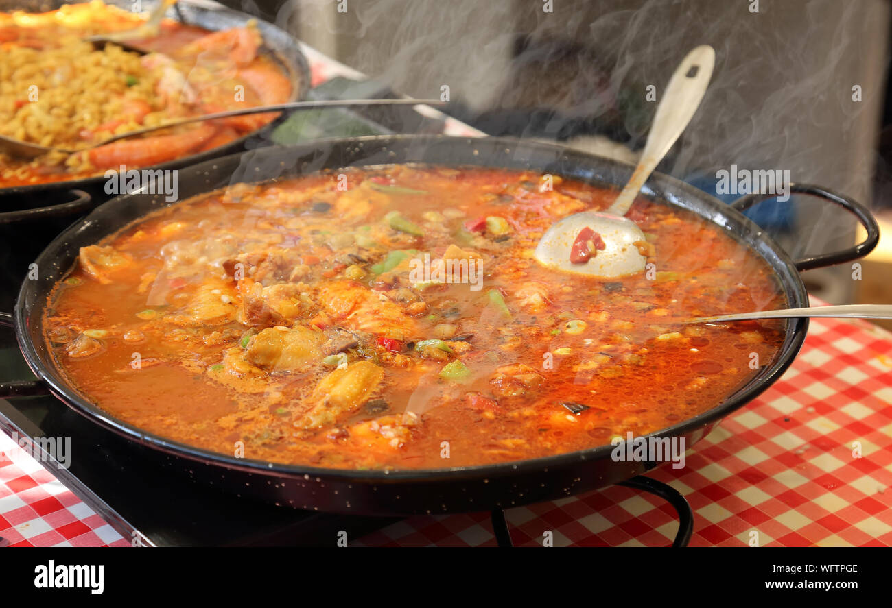 Paella preparation street market stand near Barcelona Cathedral