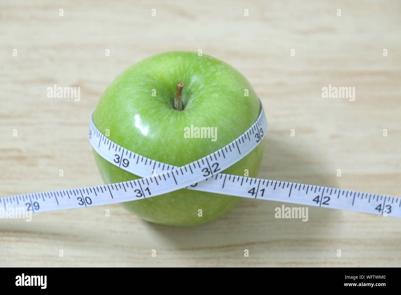Close Up Of Apple With Tape Measure On Table Stock Photo Alamy