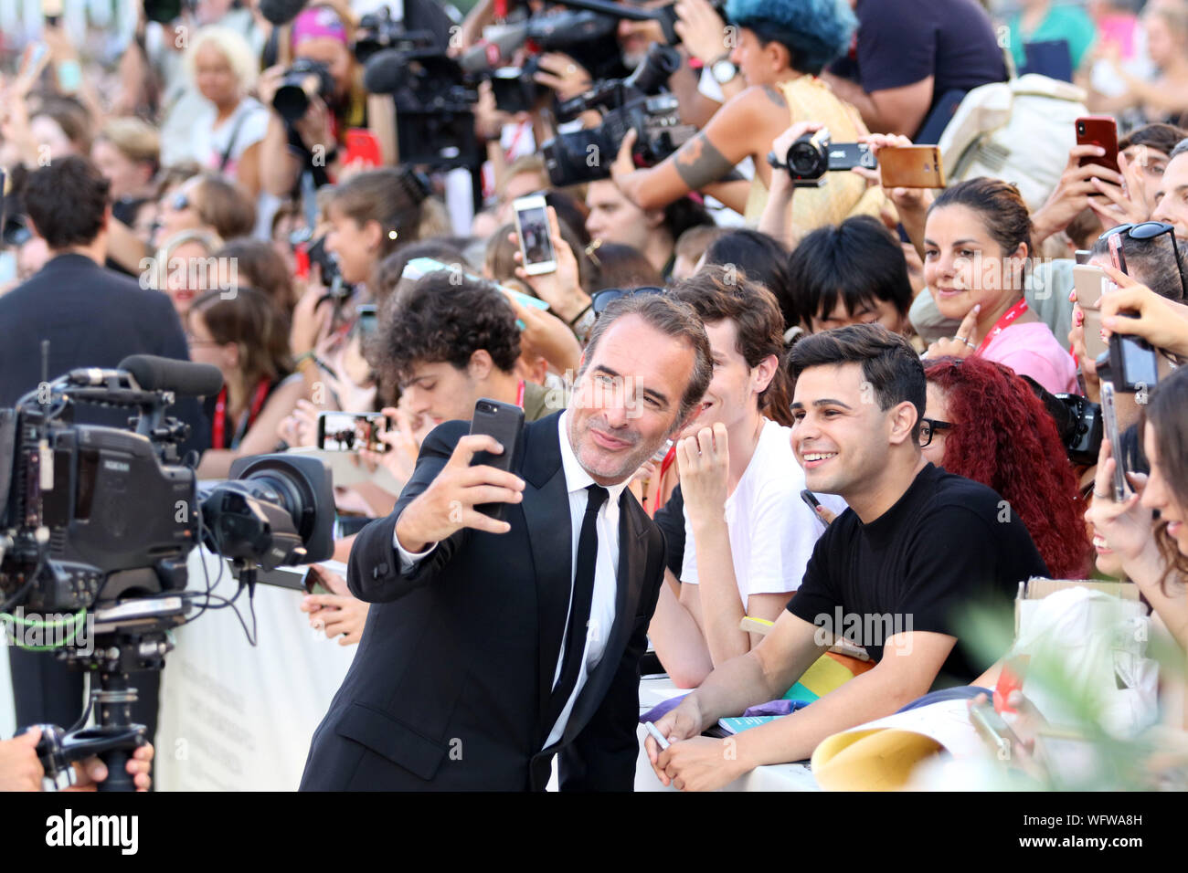 Italy, Lido di Venezia, August 30, 2019 : French actor Jean Dujardin walks the red carpet ahead of 'J'Accuse' (An Officer And A Spy) film by Roman Pol Stock Photo