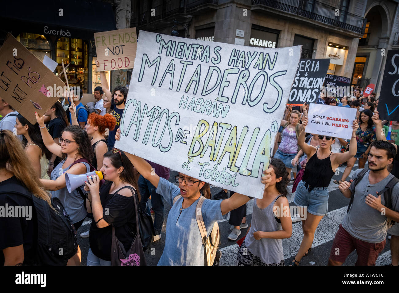 A protester holds a placard in defence of  the animal rights during the demonstration.Convened by the Barcelona Animal Save organisation hundreds of people have demonstrated in defence of animal rights and a vegan diet. Stock Photo