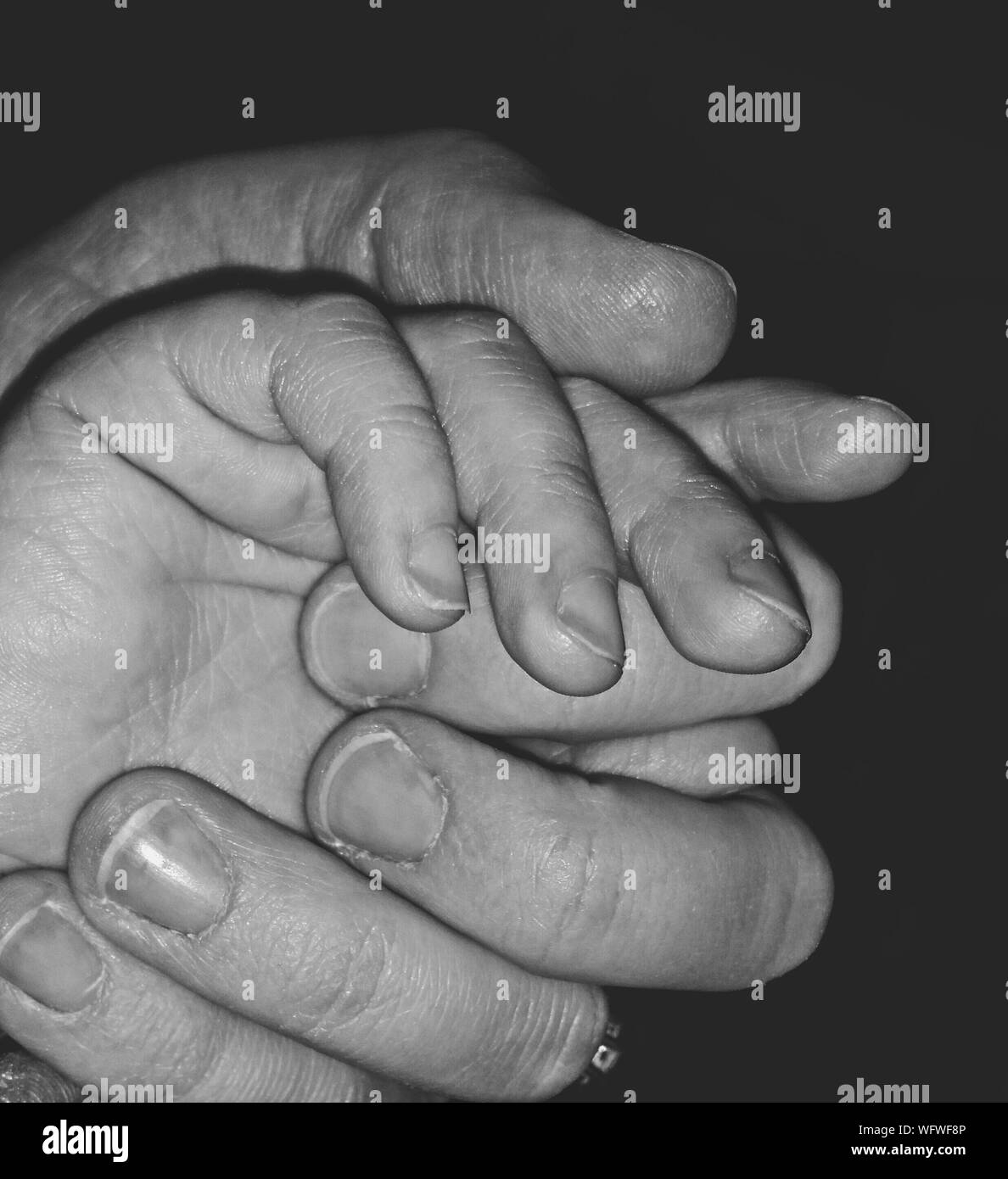 Cropped Image Of Mother Holding Son Hands Stock Photo 267936166