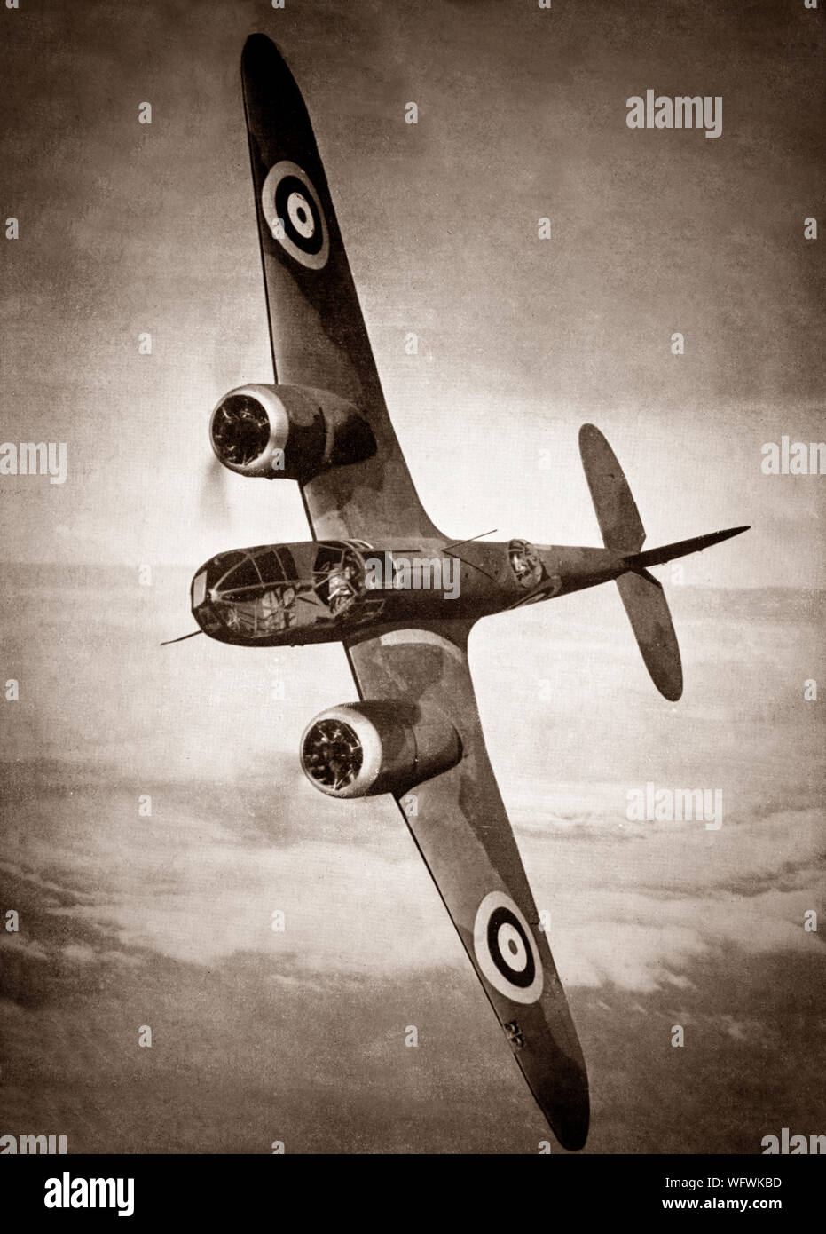 A Bristol Blenheim in flight. The British light bomber aircraft designed and built by the Bristol Aeroplane Company was used extensively in the first two years and in some cases throughout the Second World War.  It was one of the first British aircraft with an all-metal stressed-skin construction, retractable landing gear, flaps, a powered gun turret and variable-pitch propellers.It was faster than most fighters in the late 1930s but the development of monoplane fighters made it more vulnerable particularly if flown in daylight, though it proved successful as a night fighter. Stock Photo