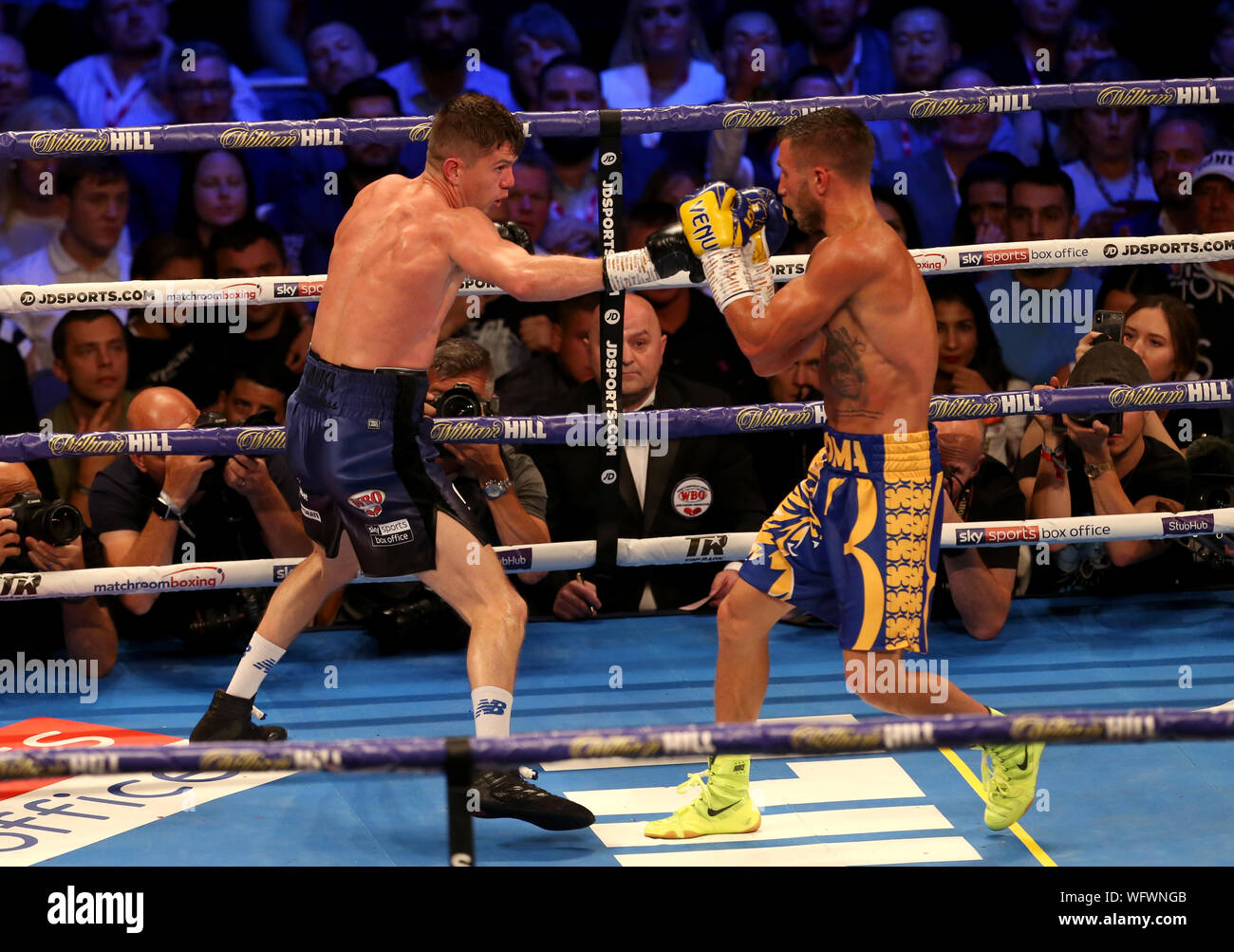 Vasiliy Lomachenko (right) and Luke Campbell in action during the WBC, WBO, WBA & Ring Magazine World Lightweight Championship contest at the O2 Arena, London. Stock Photo