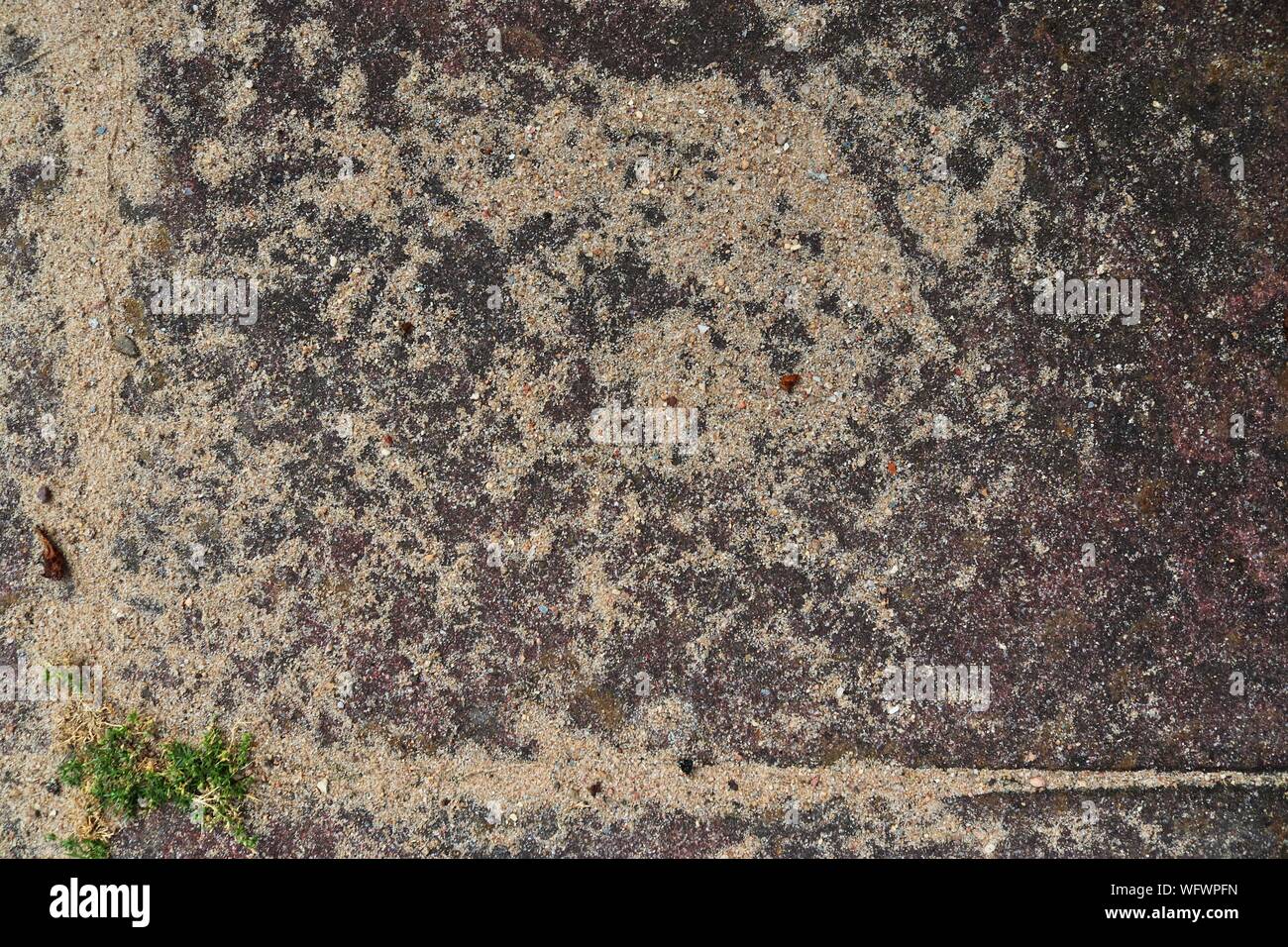 Detailed close up view on a brown sand ground texture in high resolutio ...