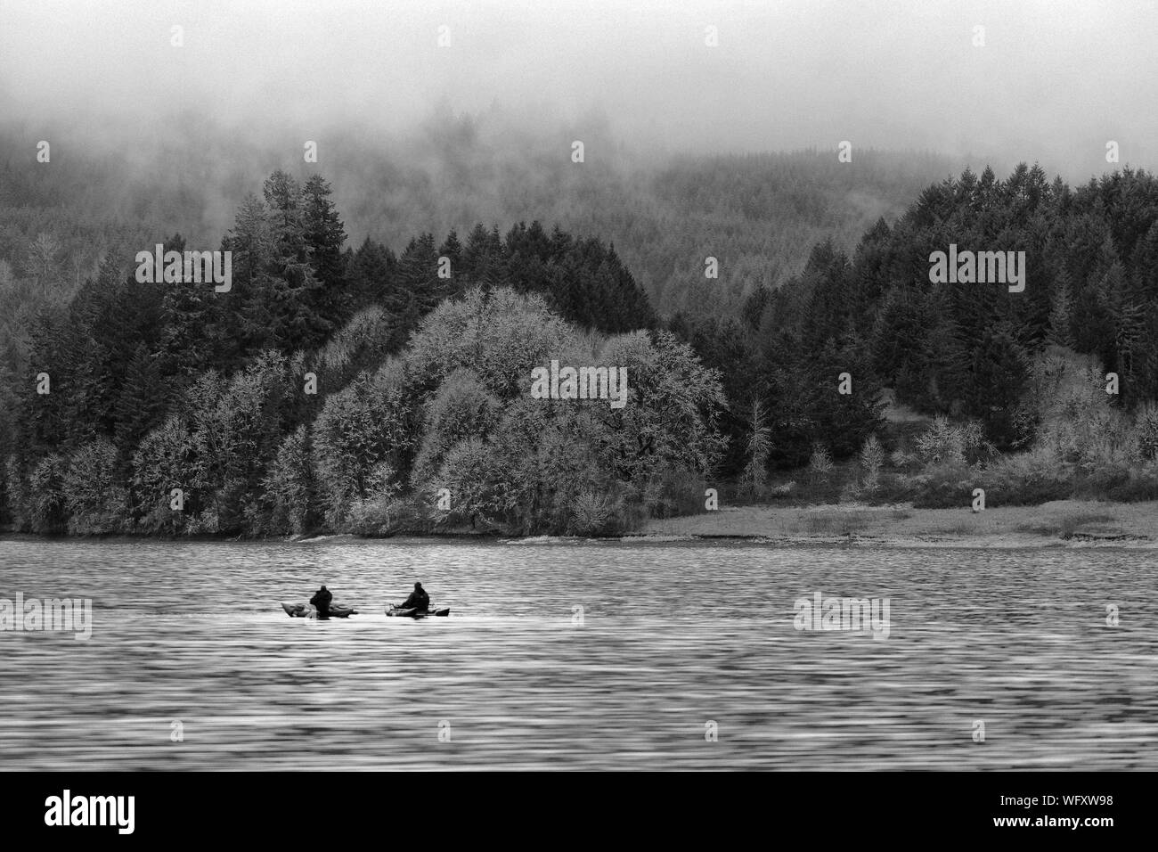 Men in rowing boat Black and White Stock Photos & Images - Alamy