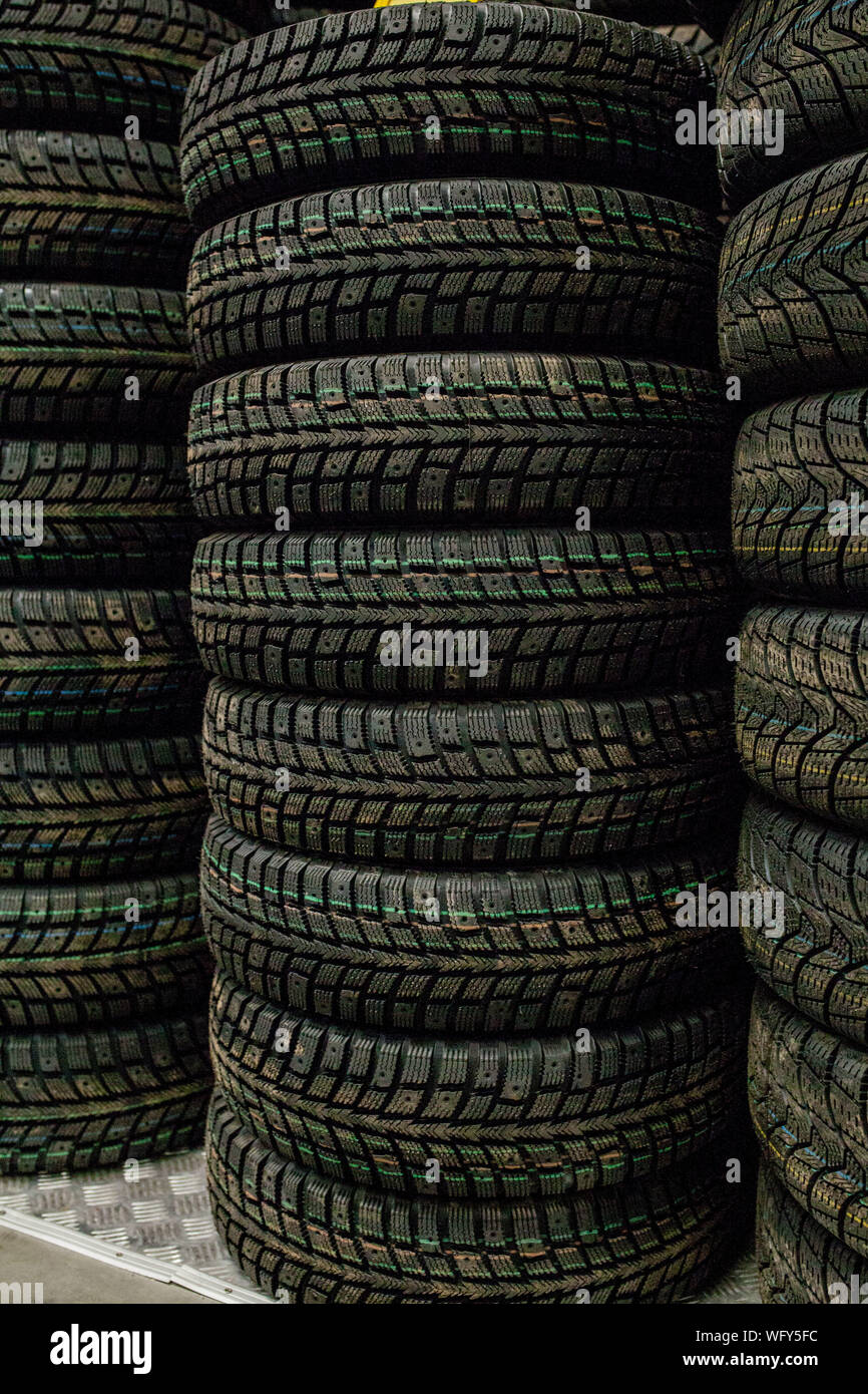 Car tires and wheels at warehouse in tire store Stock Photo Alamy