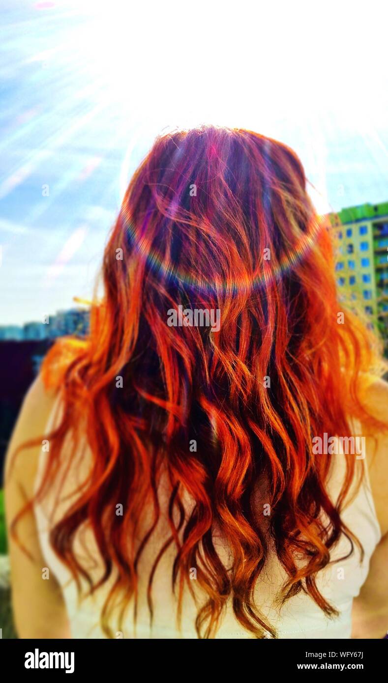 Rear View Of Redhead Girl Against Cloudy Sky Stock Photo - Alamy