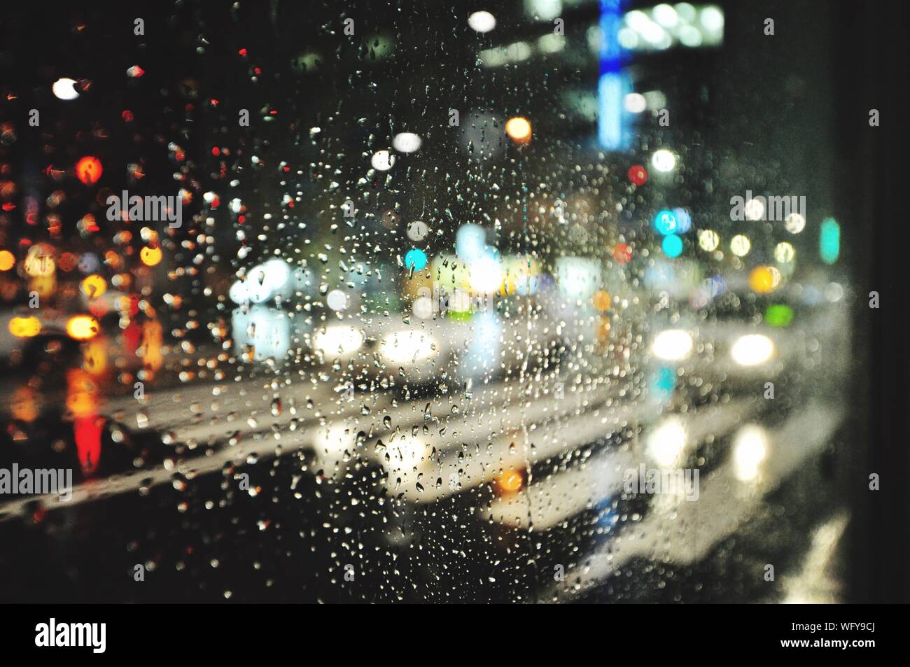 City through rainy window at night hi-res stock photography and images ...