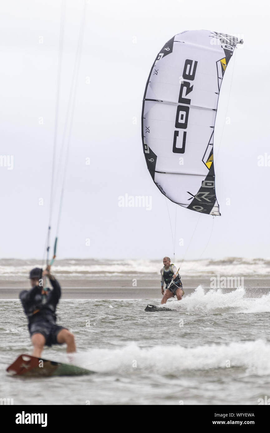 USA. 31st Aug, 2019. Kite boarders take advantage of strong winds on the Atlantic coast of Charleston ahead of Hurricane Dorian on Saturday, August 31, 2019 in Sullivans Island, South Carolina. The category 4 storm is expected to hit the Bahamas and then move north along the Eastern Seaboard. Credit: UPI/Alamy Live News Stock Photo