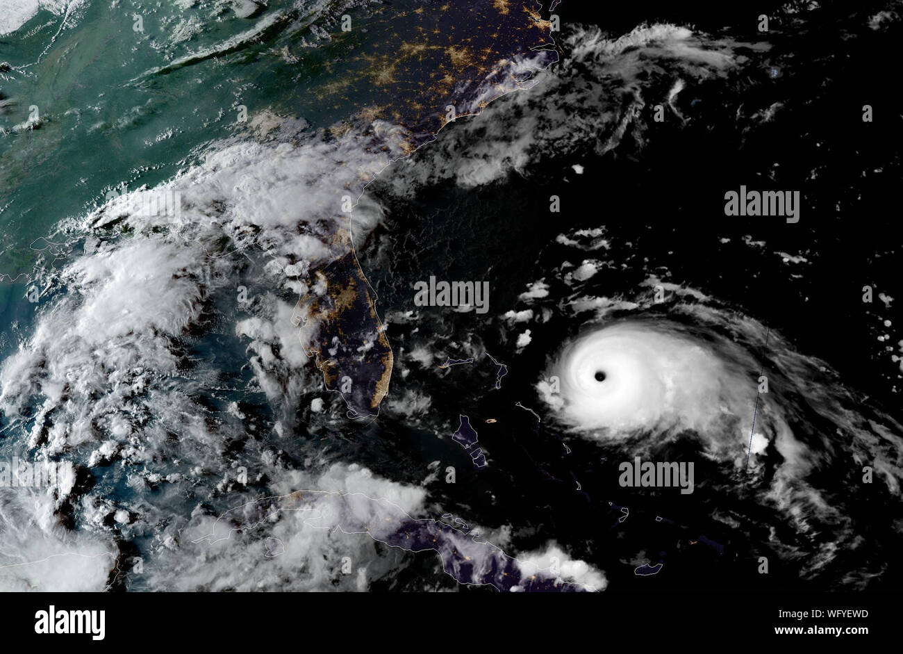 USA. 31st Aug, 2019. Hurricane Dorian is captured by NOAA's GOES-East satellite at 7:00 PM EST on August 31, 2019, 355 miles east of West Palm Beach, Florida. Maximum sustained winds remain near 150 mph (240 km/h) with higher.gusts.  Dorian is a category 4 hurricane on the Saffir-Simpson Hurricane Wind Scale. Credit: UPI/Alamy Live News Stock Photo