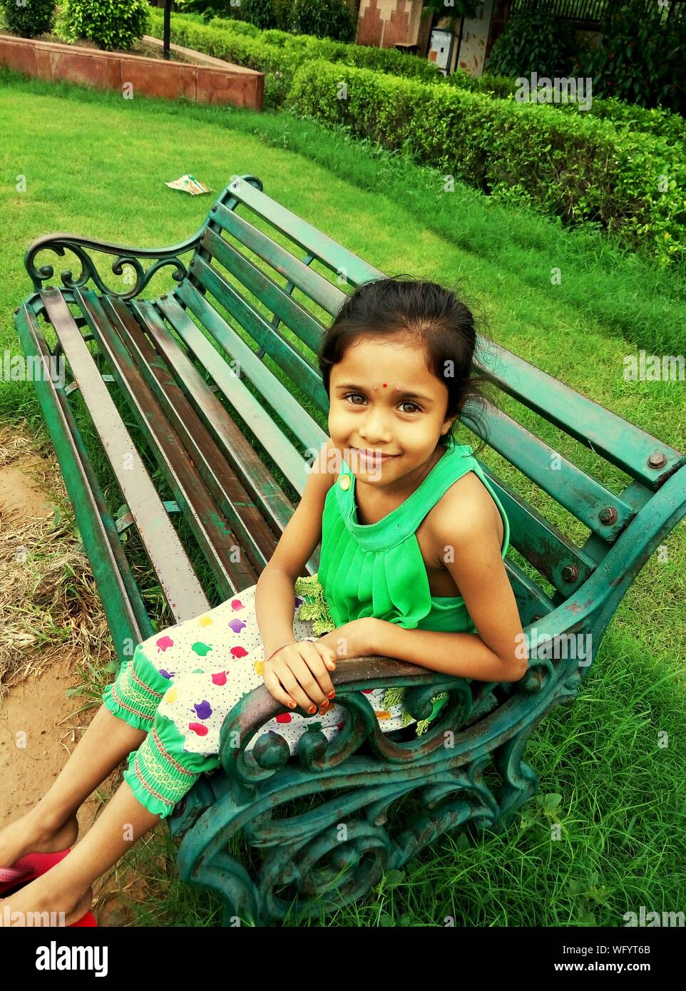 Indian girl sitting on bench hi-res stock photography and images - Alamy
