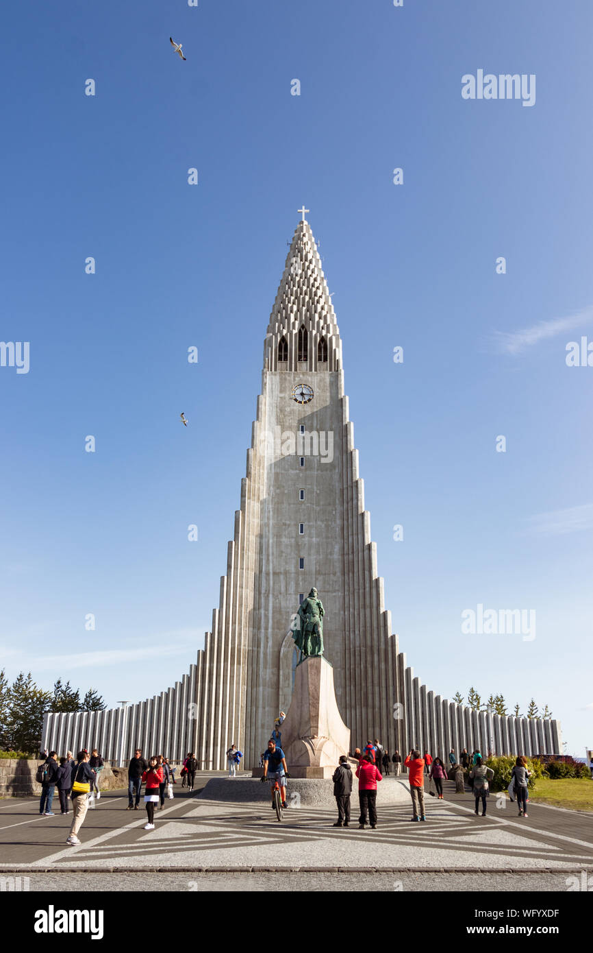 Reykjavik, Iceland - August 08, 2019: The Hallgrimskirkja cathedral in Reykjavik with tourists taking photos around, Iceland. Stock Photo