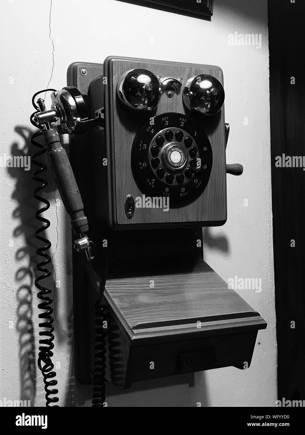 Old telephone mounted on wall hi-res stock photography and images - Alamy