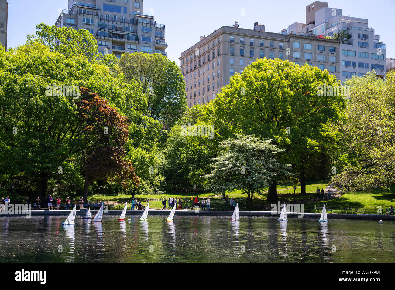 Model sailboats on the Conservatory Pond in Central Park, New York City. Stock Photo