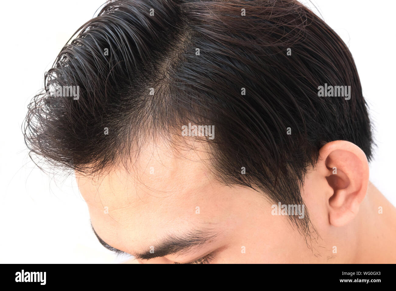 Cropped Image Of Man With Black Hair Against White Background Stock Photo