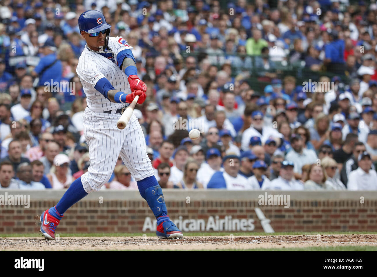 Chicago, USA. 31st Aug, 2019. Chicago Cubs shortstop Javier Baez hits a single against the Milwaukee Brewers in the sixth inning at Wrigley Field on Saturday, August 31, 2019 in Chicago. Credit: UPI/Alamy Live News Stock Photo