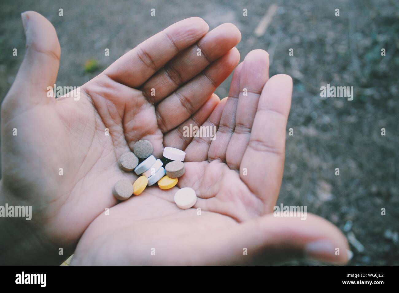 Cropped Image Of Hands With Medicines Stock Photo