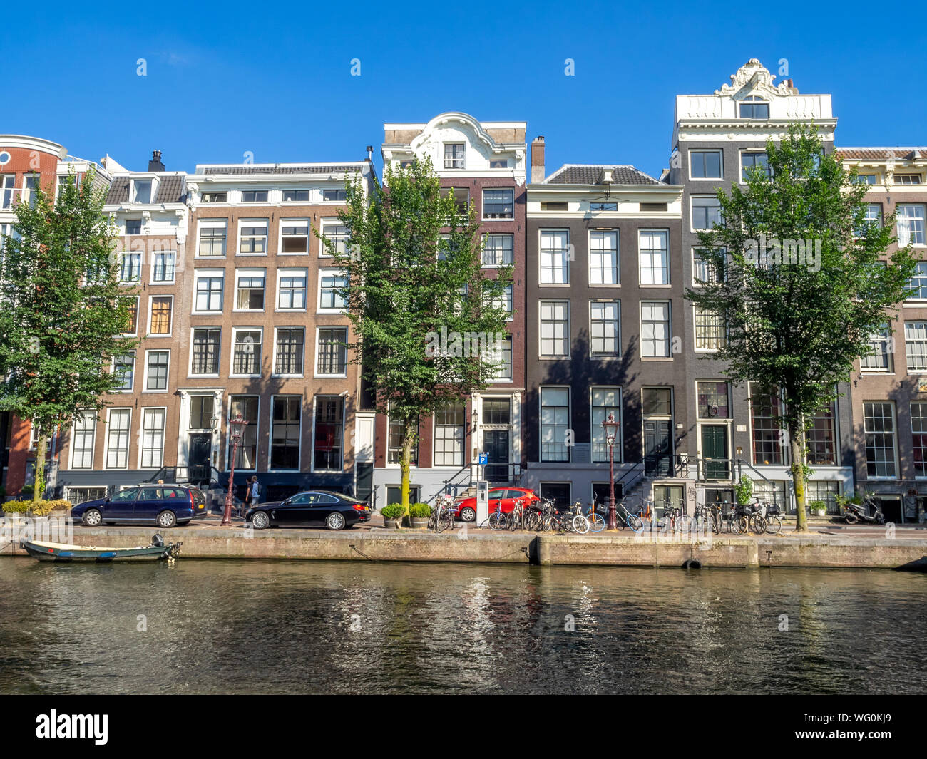 Buildings and house boats along a canal in the heart of the Netherlands