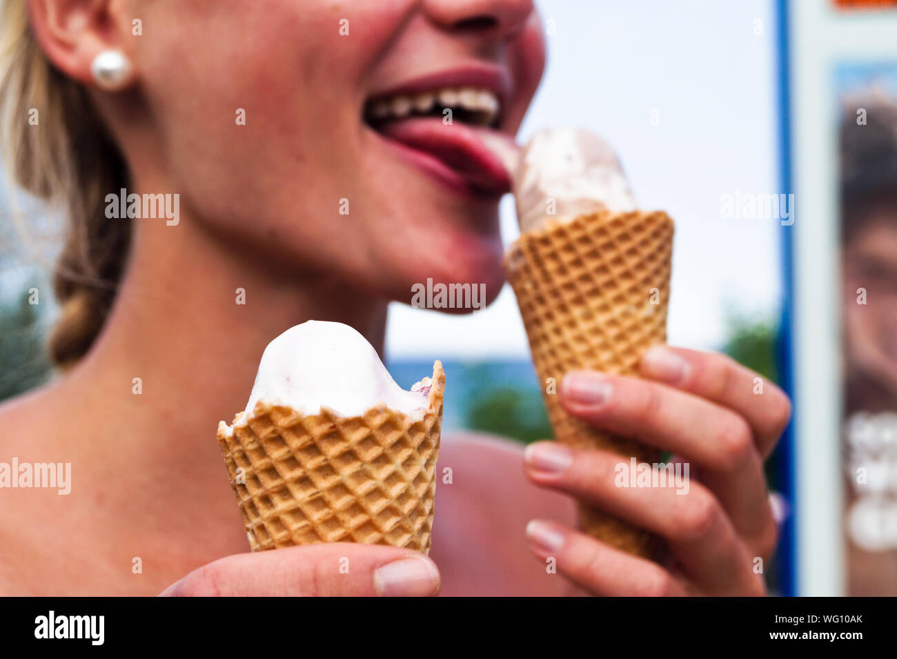 Woman Licking Ice Cream High Resolution Stock Photography and Images