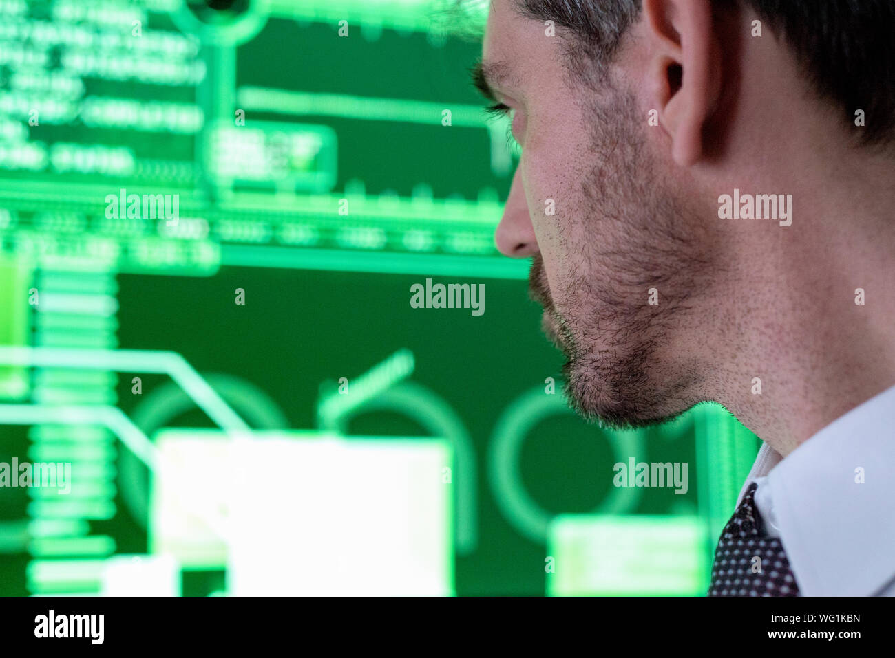 Close-up Of Man Working Looking At Screen Stock Photo
