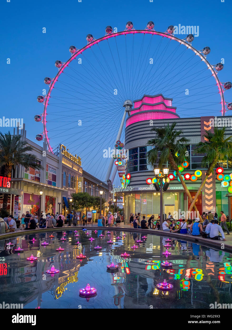 View of the the LINQ High Roller and Promenade of the LINQ Hotel & Flamingo Las Vegas Hotel & Casino at sunset. Stock Photo