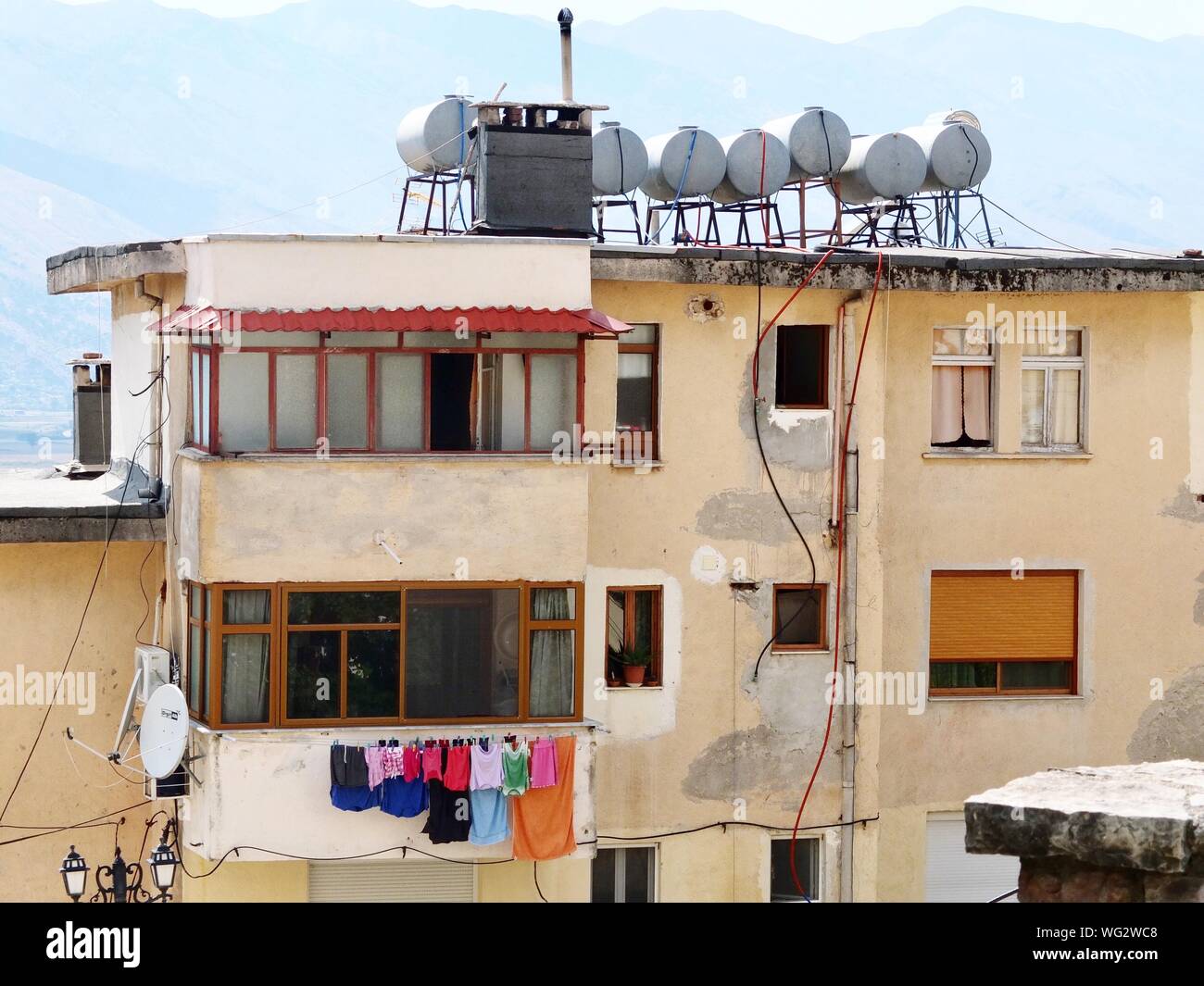 Clothes Drying On Balcony Against House Stock Photo Alamy