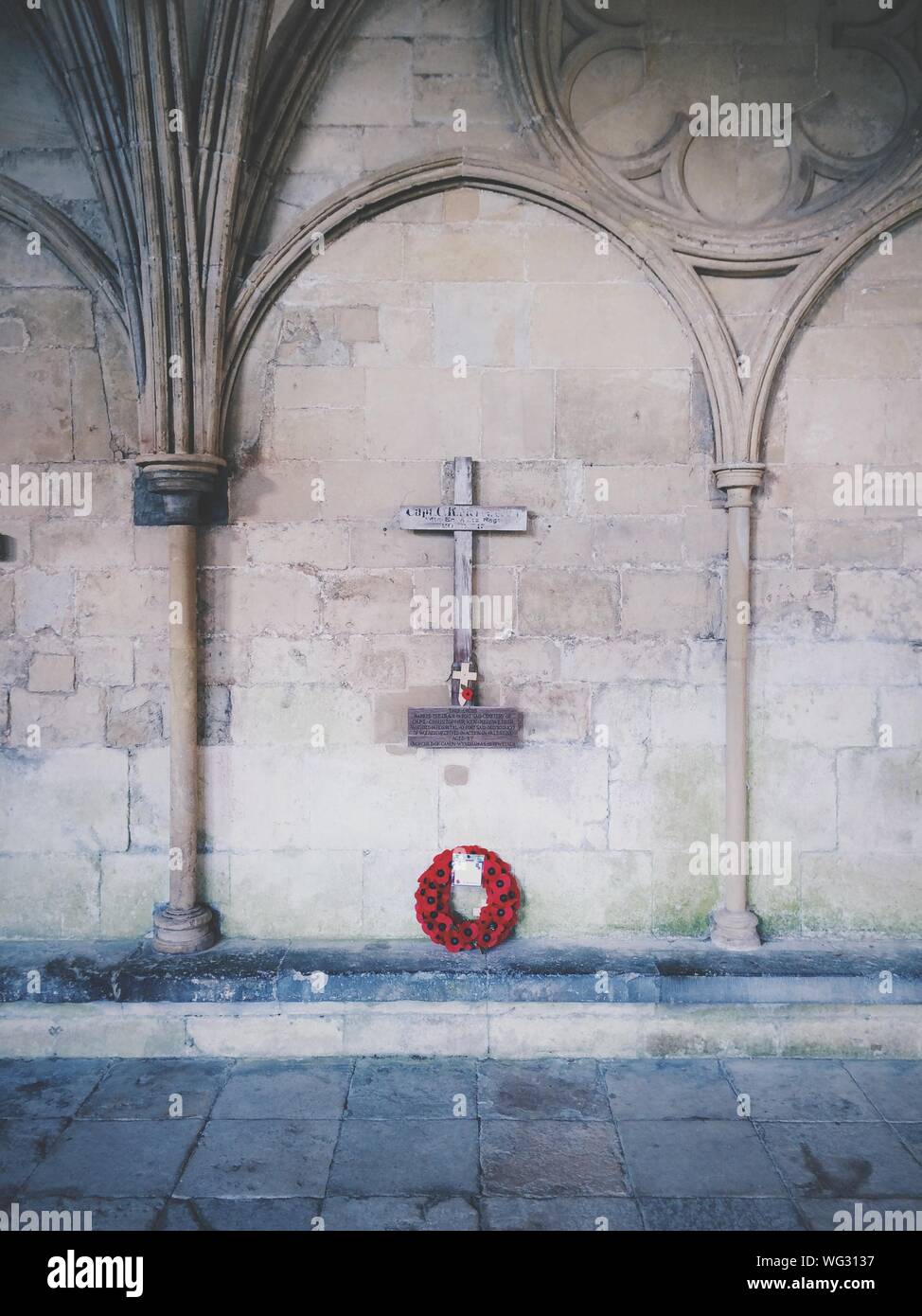 Poppy Wreath In Front Of Memorial At Salisbury Cathedral Stock Photo
