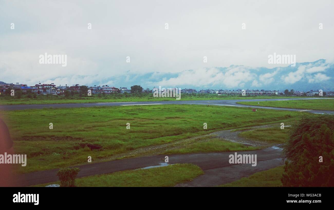 Airfield Partially Overgrown With Grass Stock Photo