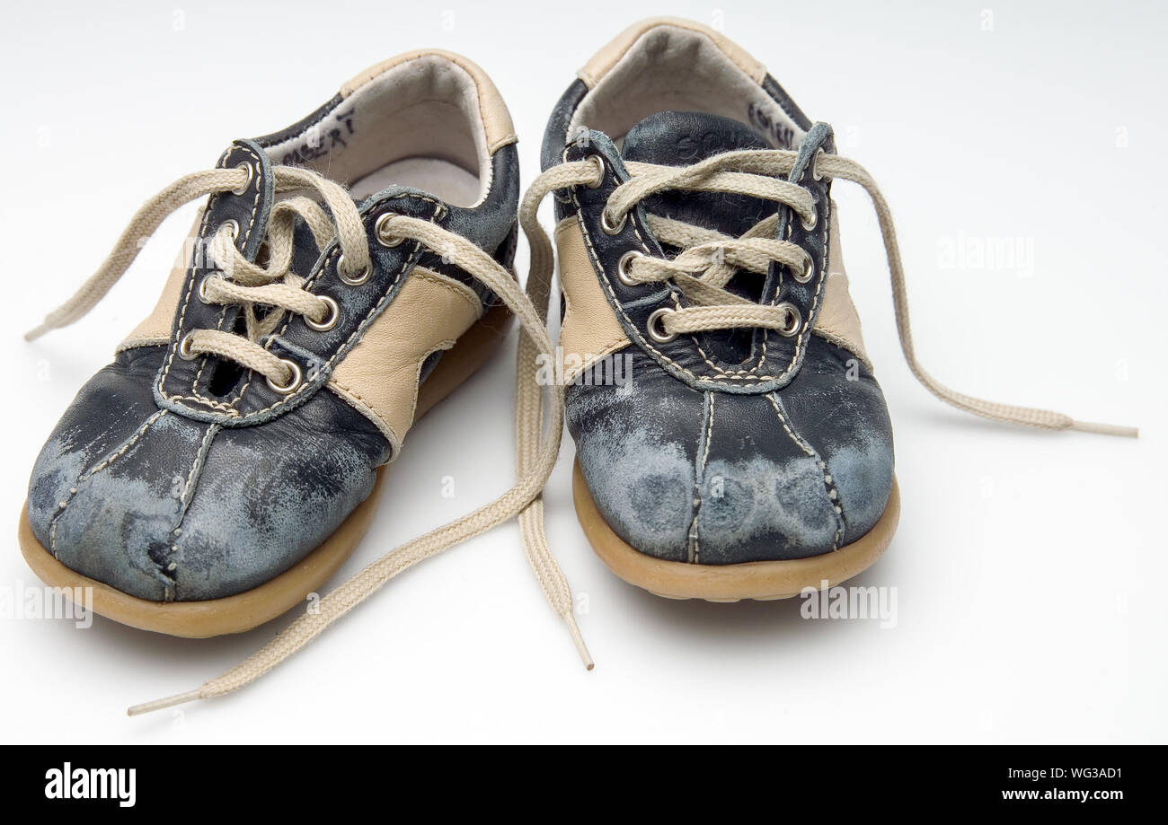 Close-up Of Damaged Shoes Over White Background Stock Photo - Alamy