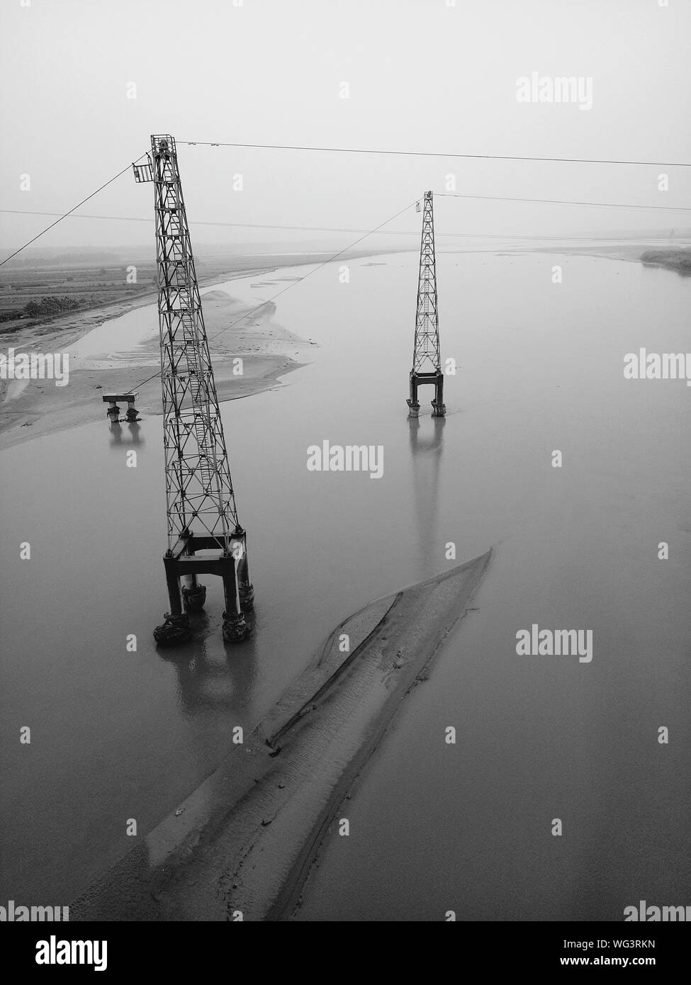Electricity pylons in water hires stock photography and images Alamy