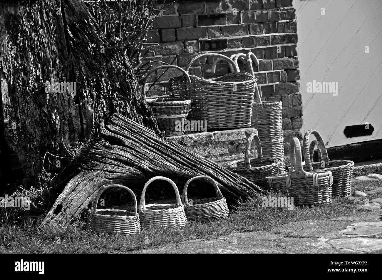 Wicker Baskets By Brick Wall Stock Photo Alamy