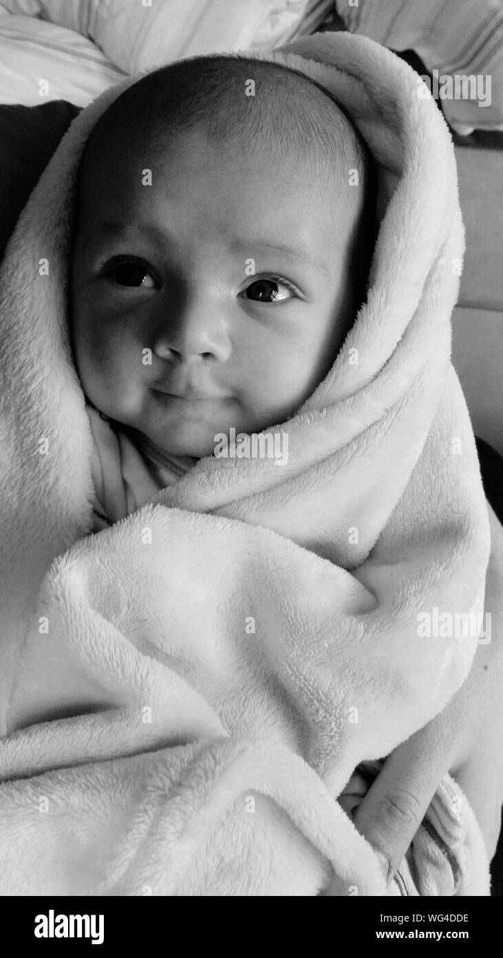 New born baby wrapped in blanket hires stock photography and images Alamy
